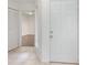 Bright entryway with tile flooring, a white closet door, and a view into the next room at 7863 Sugar Bend Dr # 7863, Orlando, FL 32819