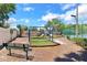 Community playground with swings, slides, and a bench, providing a fun outdoor space at 7863 Sugar Bend Dr # 7863, Orlando, FL 32819