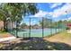 Well-maintained community tennis courts, fenced for privacy, offering an active lifestyle at 7863 Sugar Bend Dr # 7863, Orlando, FL 32819