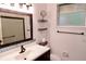 Bathroom featuring a tiled backsplash, dark wood vanity, and a framed mirror at 8044 Rural Retreat Ct, Orlando, FL 32819