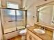Bright bathroom featuring tub and shower combo with granite countertop at 8044 Rural Retreat Ct, Orlando, FL 32819