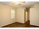 Neutral bedroom with fan, window, and carpeted floors at 8044 Rural Retreat Ct, Orlando, FL 32819