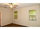 Bedroom featuring neutral tones, two windows, and ceiling fan at 8044 Rural Retreat Ct, Orlando, FL 32819