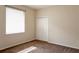 Cozy bedroom with carpet flooring, window, and built-in closet at 8044 Rural Retreat Ct, Orlando, FL 32819