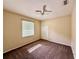 Bedroom features neutral walls, a ceiling fan, and carpeted floors at 8044 Rural Retreat Ct, Orlando, FL 32819