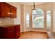 Bright breakfast nook with hardwood floors and natural light streaming through large windows at 8044 Rural Retreat Ct, Orlando, FL 32819