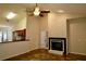 Open-concept living room featuring a fireplace and vaulted ceilings at 8044 Rural Retreat Ct, Orlando, FL 32819