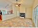 Open living space featuring fireplace, tile floors, and kitchen at 8044 Rural Retreat Ct, Orlando, FL 32819