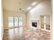 Living room featuring fireplace, tile floors, and sliding glass doors at 8044 Rural Retreat Ct, Orlando, FL 32819