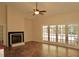 Spacious living room featuring a fireplace, tile floor, and sliding glass doors leading to the pool at 8044 Rural Retreat Ct, Orlando, FL 32819