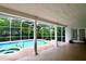 Screened-in pool area with white columns and a covered patio at 8044 Rural Retreat Ct, Orlando, FL 32819