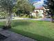 Charming neighborhood street featuring mature trees and a view of luxury homes at 907 N Hyer Ave, Orlando, FL 32803