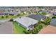 Aerial view showcasing a well-manicured property in a friendly neighborhood, highlighting the patio and outdoor space at 924 Figwood Loop, The Villages, FL 32163