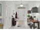 Bright foyer featuring tile flooring and modern decor, leading into the main living areas at 924 Figwood Loop, The Villages, FL 32163