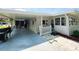 Spacious carport providing covered parking and easy access to the home at 103 Poinsettia Cv, Leesburg, FL 34748