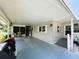 Spacious carport area with room for parking and storage at 103 Poinsettia Cv, Leesburg, FL 34748