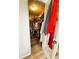 Walk-in closet featuring built-in shelving and ample storage for organization at 103 Poinsettia Cv, Leesburg, FL 34748