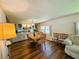 Comfortable dining room with hard wood floors, decorative lighting and built in cabinetry at 103 Poinsettia Cv, Leesburg, FL 34748