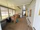 Bright enclosed porch, perfect for relaxing with plenty of natural light at 103 Poinsettia Cv, Leesburg, FL 34748