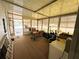 Spacious enclosed porch with plenty of room for seating and storage at 103 Poinsettia Cv, Leesburg, FL 34748