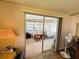 Bright Florida room with sliding glass doors leading to the interior at 103 Poinsettia Cv, Leesburg, FL 34748