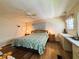 The main bedroom has hard floors, a window and ceiling fan for comfort at 103 Poinsettia Cv, Leesburg, FL 34748