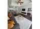 Inviting living area with a stylish rug, open to a modern kitchen and connected to the main bedroom at 1310 Seven Eagles Ct # 102, Reunion, FL 34747