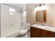Bathroom with marble vanity, tile floors, and shower/tub combo at 1330 Englewood Dr, St Cloud, FL 34772