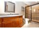 Bathroom featuring tile floors, vanity, toilet, and shower with glass door at 1330 Englewood Dr, St Cloud, FL 34772