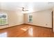 Bright bedroom featuring hardwood floors, natural light, and a ceiling fan at 1330 Englewood Dr, St Cloud, FL 34772