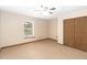 Bedroom featuring carpet floors, neutral walls, and natural light from window at 1330 Englewood Dr, St Cloud, FL 34772