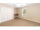 Bedroom with carpet floors, ceiling fan, closet, and natural light from a window at 1330 Englewood Dr, St Cloud, FL 34772