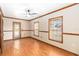 Cozy bedroom featuring hardwood floors, natural light, and a ceiling fan at 1330 Englewood Dr, St Cloud, FL 34772