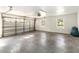 Spacious garage with room for parking and storage, featuring bright lighting and a large garage door at 1330 Englewood Dr, St Cloud, FL 34772