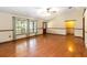 Open living room with hardwood floors and plenty of natural light at 1330 Englewood Dr, St Cloud, FL 34772