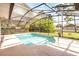 Inviting screened-in pool offers a refreshing escape with a spacious deck and lush surroundings at 1330 Englewood Dr, St Cloud, FL 34772