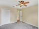 This bedroom offers neutral walls, ceiling fan, and ample closet space at 310 Dagama Ct, Kissimmee, FL 34758