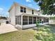 This home features a large screened in back porch with a view of the back yard at 310 Dagama Ct, Kissimmee, FL 34758