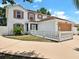 Charming two-story home showcases a large garage, well-kept landscaping, and a lovely white picket fence at 310 Dagama Ct, Kissimmee, FL 34758