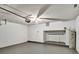This garage features a ceiling fan, water heater, door to the house, and built-in shelves at 310 Dagama Ct, Kissimmee, FL 34758