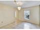 Bright living room featuring tile flooring, chandelier lighting and a view to the next room at 310 Dagama Ct, Kissimmee, FL 34758
