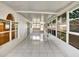 Enclosed patio with tiled floors and multiple windows offering plenty of natural light at 310 Dagama Ct, Kissimmee, FL 34758