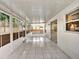 Enclosed patio area with tile flooring, large windows and sliding glass doors to the exterior at 310 Dagama Ct, Kissimmee, FL 34758