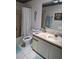Bathroom featuring a vanity with sink, mirror, and shower with curtain at 527 San Pedro Dr, The Villages, FL 32159