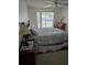 Bedroom with a large window, desk, and ceiling fan at 527 San Pedro Dr, The Villages, FL 32159
