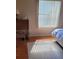 Bright bedroom featuring a desk area, wood floors, and a cozy atmosphere at 527 San Pedro Dr, The Villages, FL 32159