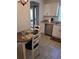 Eat-in kitchen with modern appliances, tile flooring, and a view of the backyard patio at 527 San Pedro Dr, The Villages, FL 32159