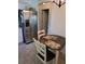 Cozy eat-in kitchen area with stainless steel refrigerator and adjacent doorway at 527 San Pedro Dr, The Villages, FL 32159
