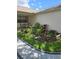 Close-up of the well-manicured garden with vibrant plants and charming accents at 527 San Pedro Dr, The Villages, FL 32159