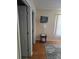 Living area featuring hard wood floors and a television mounted on the wall at 527 San Pedro Dr, The Villages, FL 32159